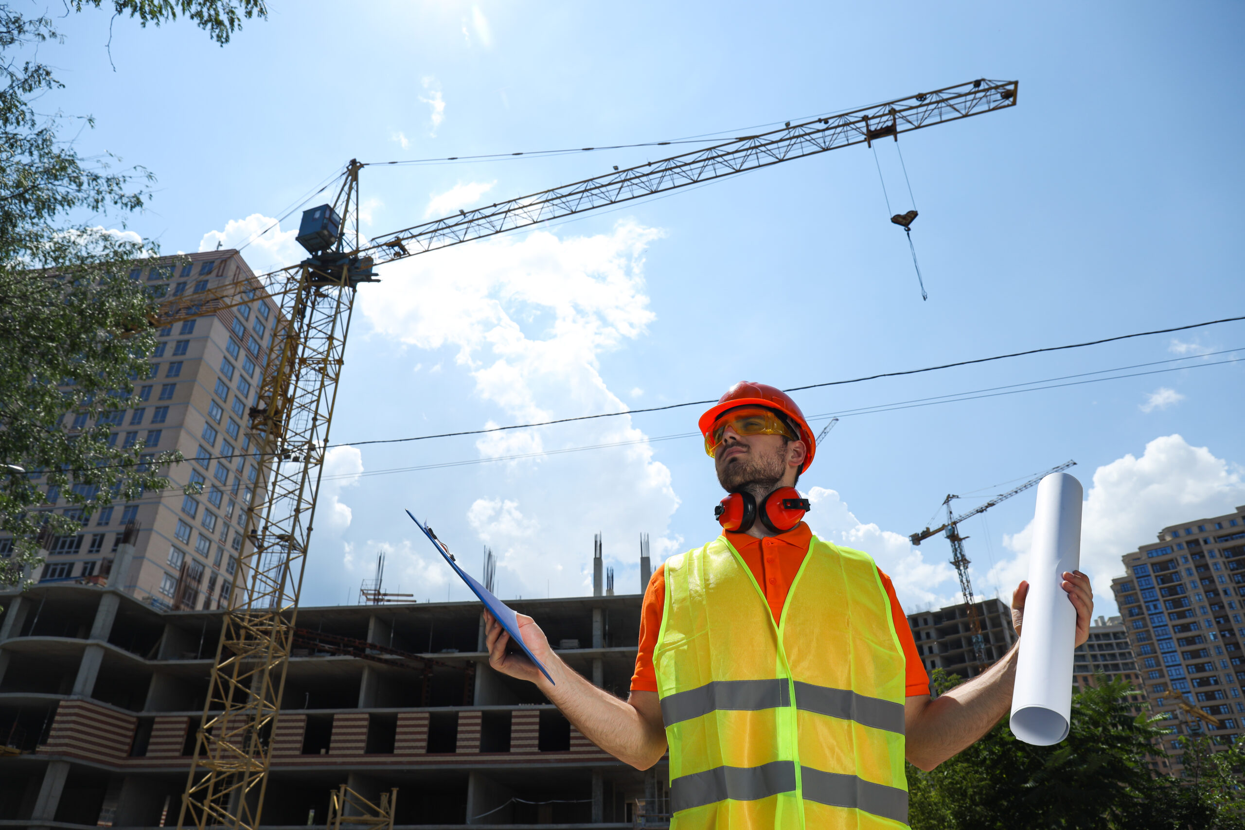 Young man civil engineer in safety hat